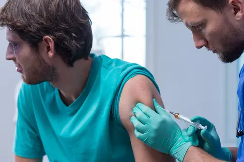 Man receiving vaccine