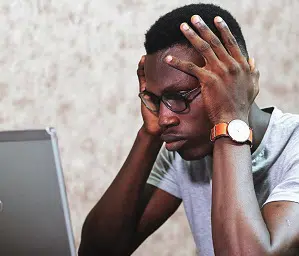 Man looking confused at the computer