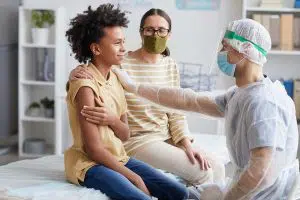 Photo of teenager getting vaccinated