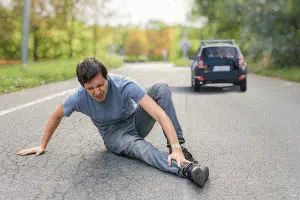 photo of a man in pain after experiencing a hit and run
